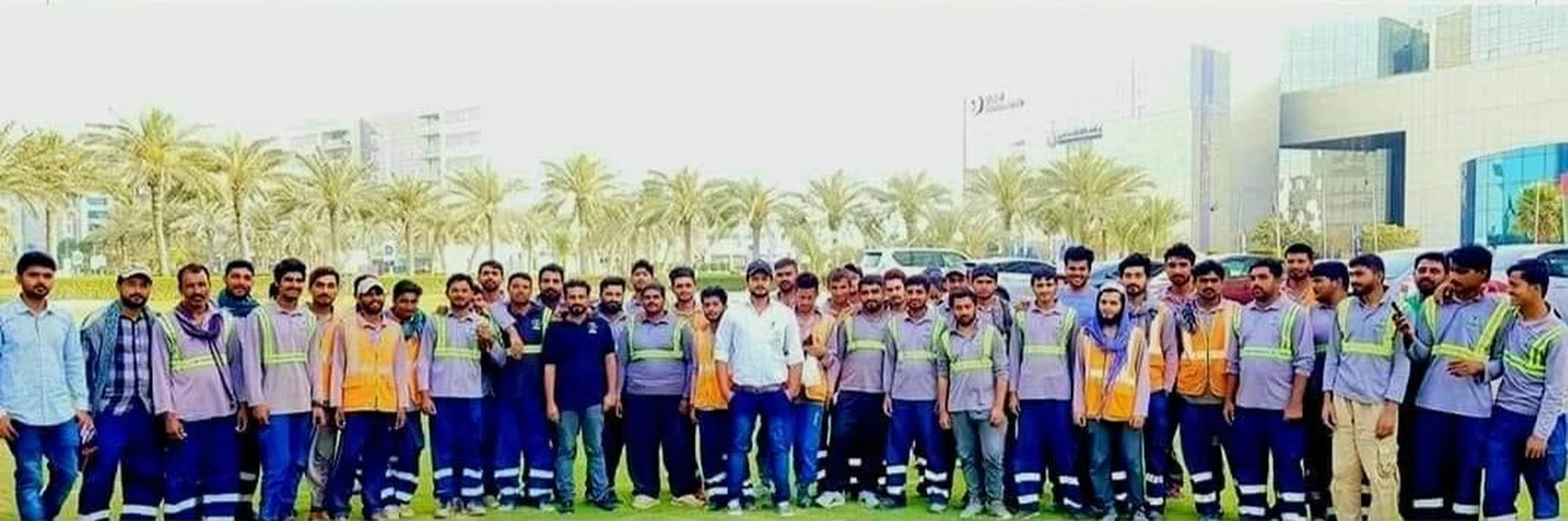 Lush Green landscaping team gathered outdoors
